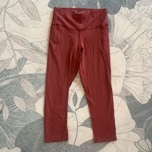 Under Armour - Sz small. Rust color Capri leggings w/ pockets. Never worn.